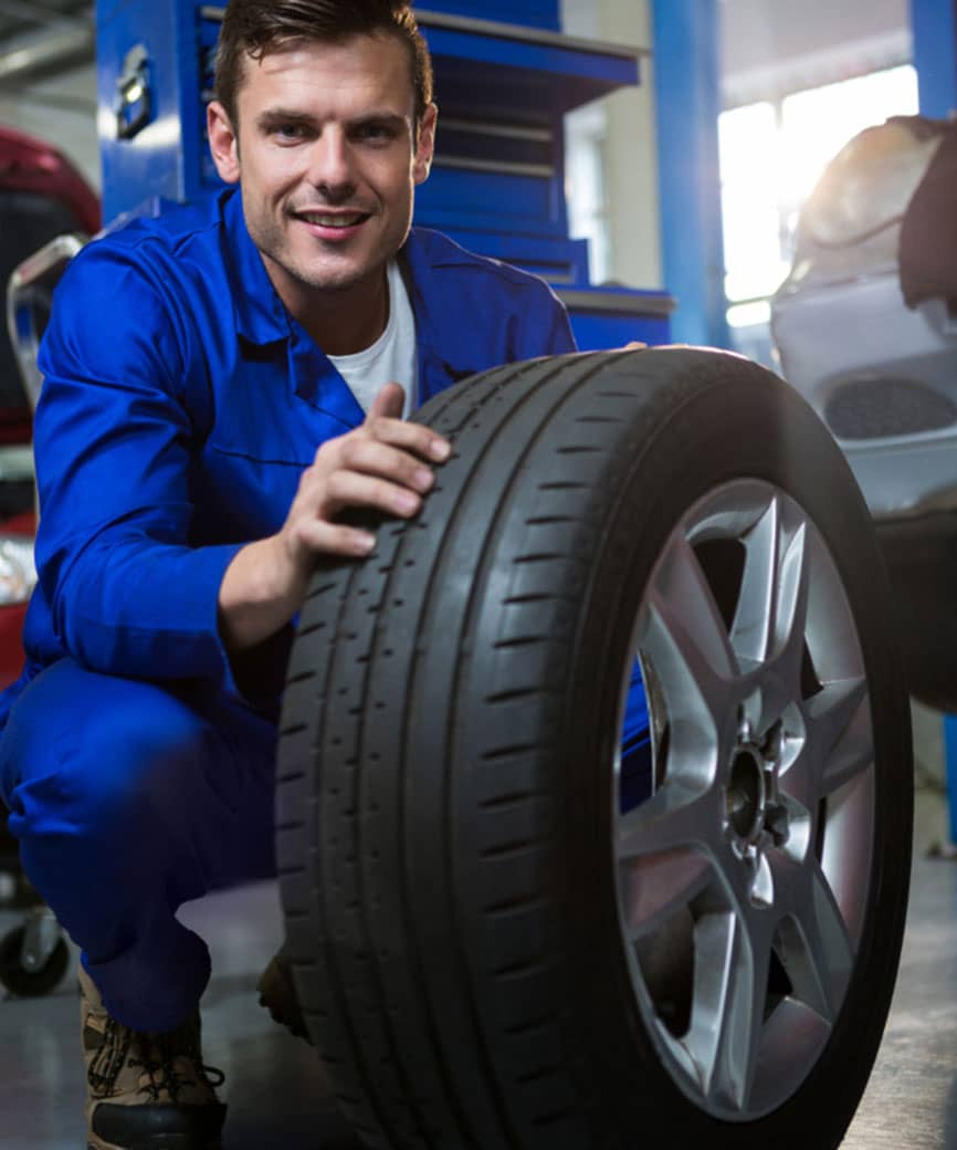 mechanic with a tire