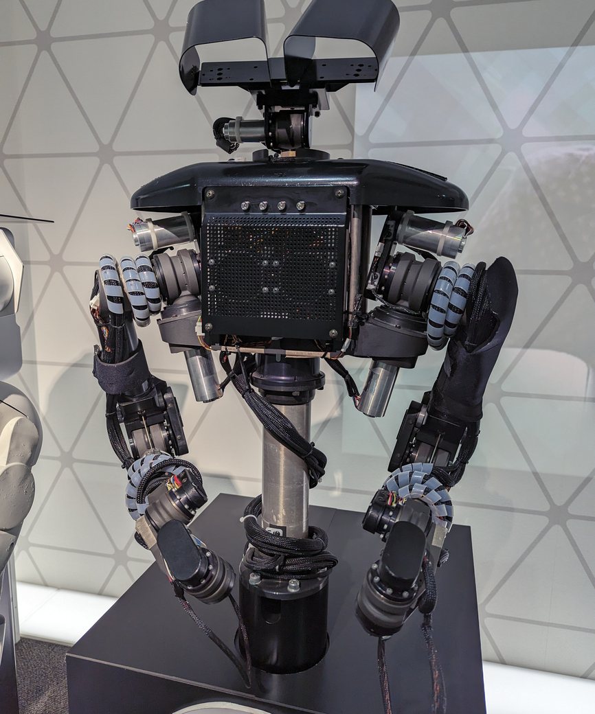 Two-armed research robot with stereo cameras and exposed actuators